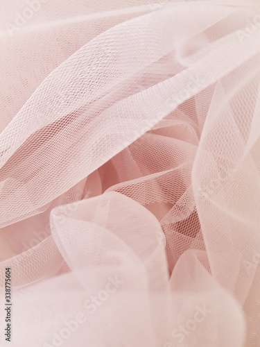 фотографія Abstract folded soft blush pink tulle background, Tulle texture, Tulle close up