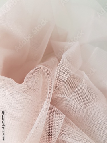 Abstract folded soft blush pink tulle background, Tulle texture, Tulle close up