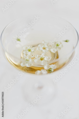 flowers in coupe champagne glass