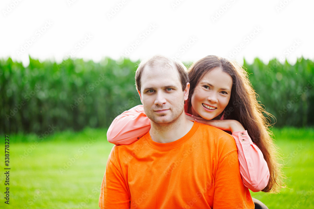 Portrait of happy mid adult couple posing outdoors