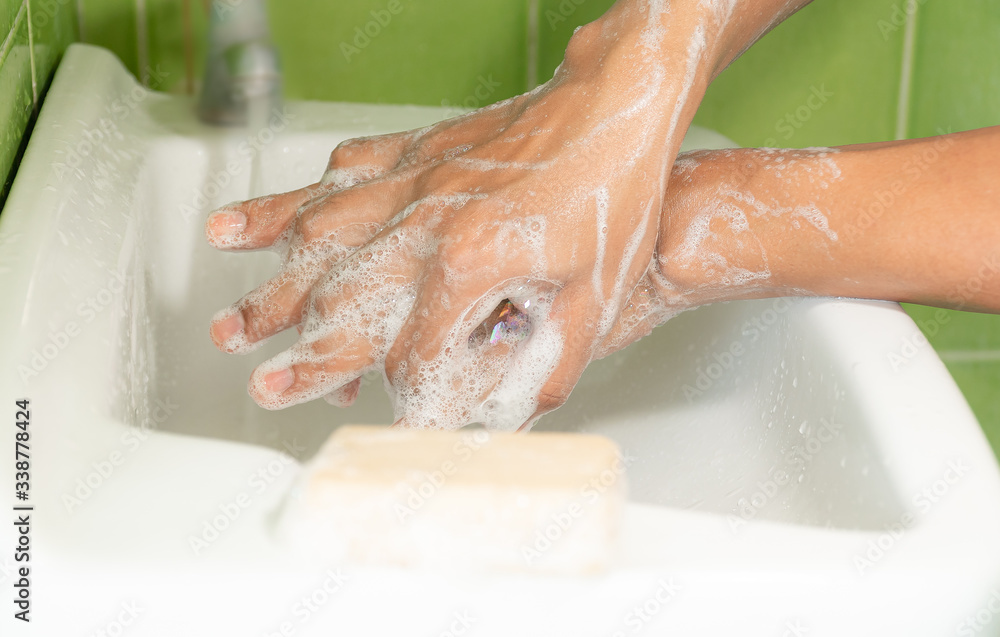 Fototapeta premium People washing hands with soap in sinks. Apply all over the arms and the nook of fingers. To get rid of dirt that is contaminated including bacteria.