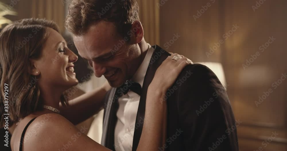 Happy young couple dancing at a party. Handsome young man and woman enjoying dancing at a gala night.
Happy young couple dancing at a party. Handsome young man and woman enjoying dancing at a gala night.