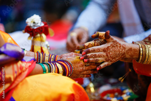 Indian wedding ceremony: bridal hand in haldi ceremony