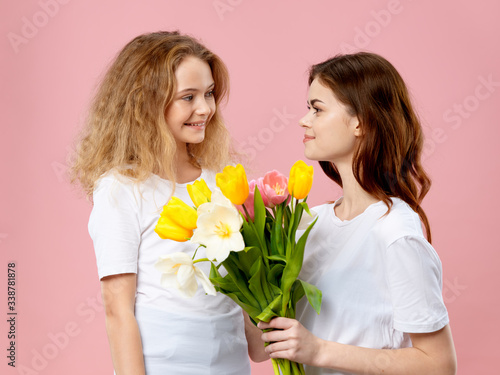 mother and daughter with flowers