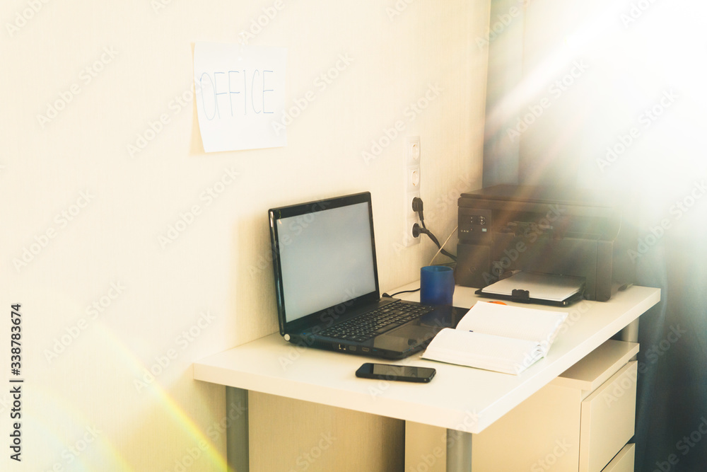 Home office workplace. Work from home. Laptop, notebook, bluetooth speaker and cup of tea on the table. Freelance, work at home or quarantine concept. Copy space. Home office workplace. Work from home. Laptop, notebook, bluetooth speaker and cup of tea on the table. Freelance, work at home or quarantine concept. Copy space.