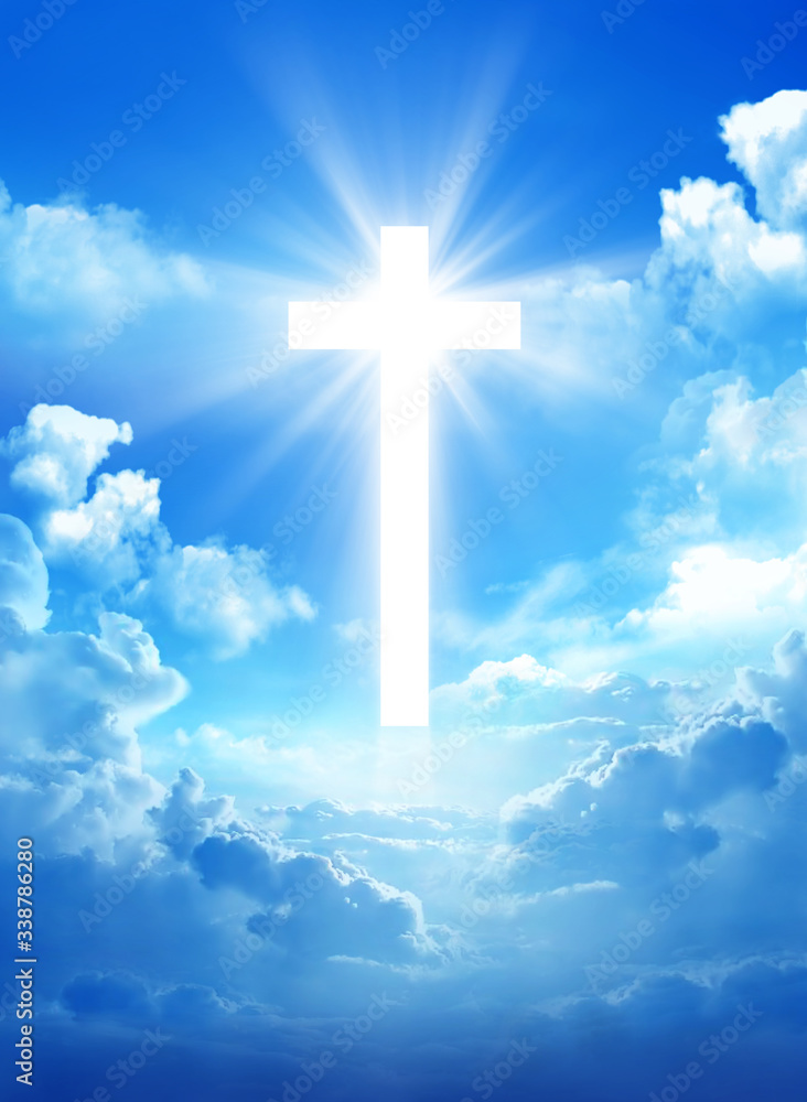 Cross in the cloudy sky with light rays Cross in the cloudy sky with light rays