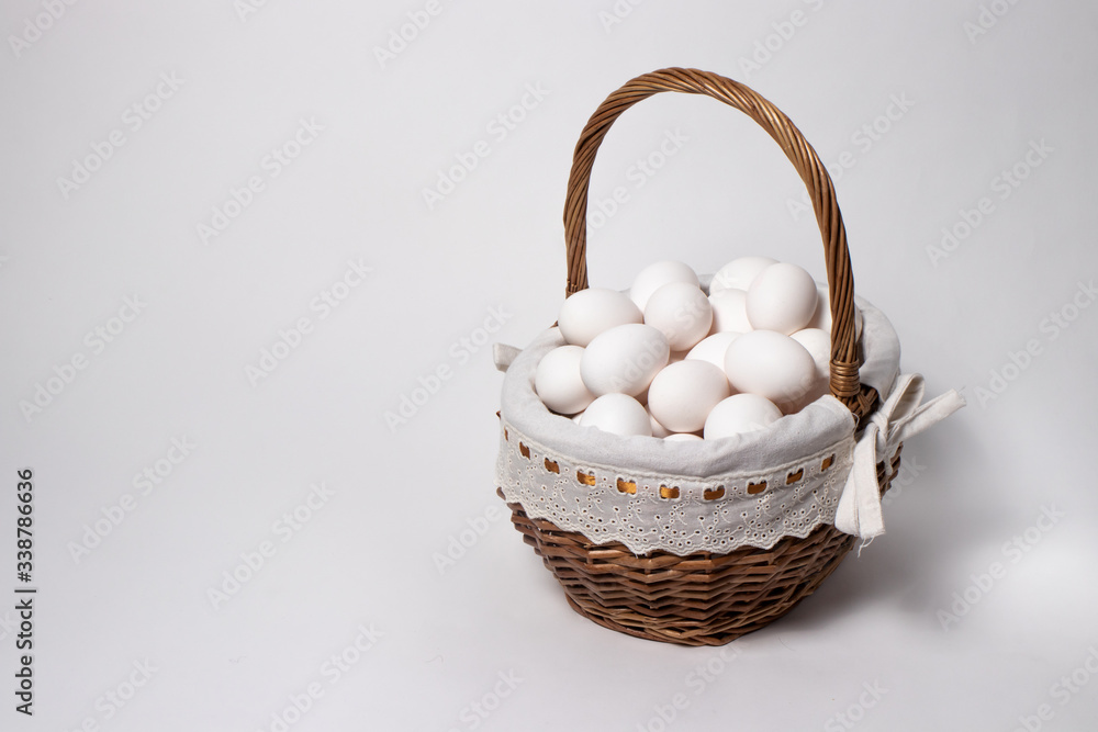 
Easter wicker basket from a natural vine with eggs. Beautifully designed baskets in a minimalist style.