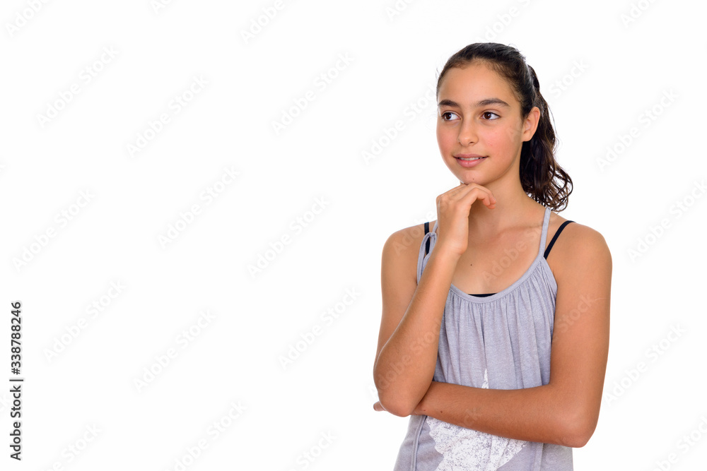 Studio shot of young beautiful teenage girl thinking isolated against white background Studio shot of young beautiful teenage girl thinking isolated against white background