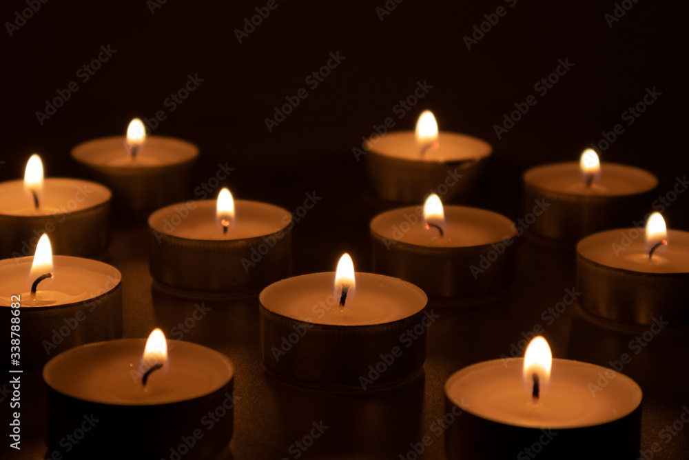 Lantern flares in the obscurity, candles symbolizing loss and frustrating feelings