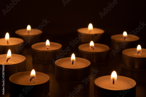 Lantern flares in the obscurity  candles symbolizing loss and frustrating feelings