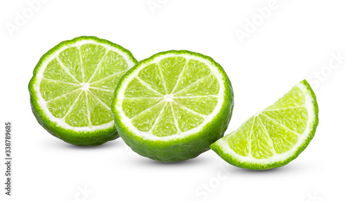 half of bergamot or kaffir with seeds isolated on white background