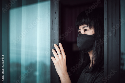 Asian woman wearing a black...