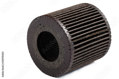 Old and dirty oil filter isolated on white background.Copy space