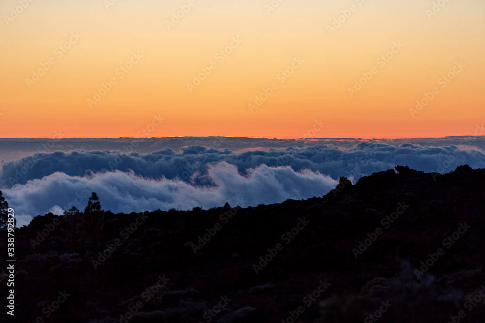 Detail of the clouds under the mountain during a sunset in Teide mountain, Tenerife, Canary Islands, Spain Detail of the clouds under the mountain during a sunset in Teide mountain, Tenerife, Canary Islands, Spain