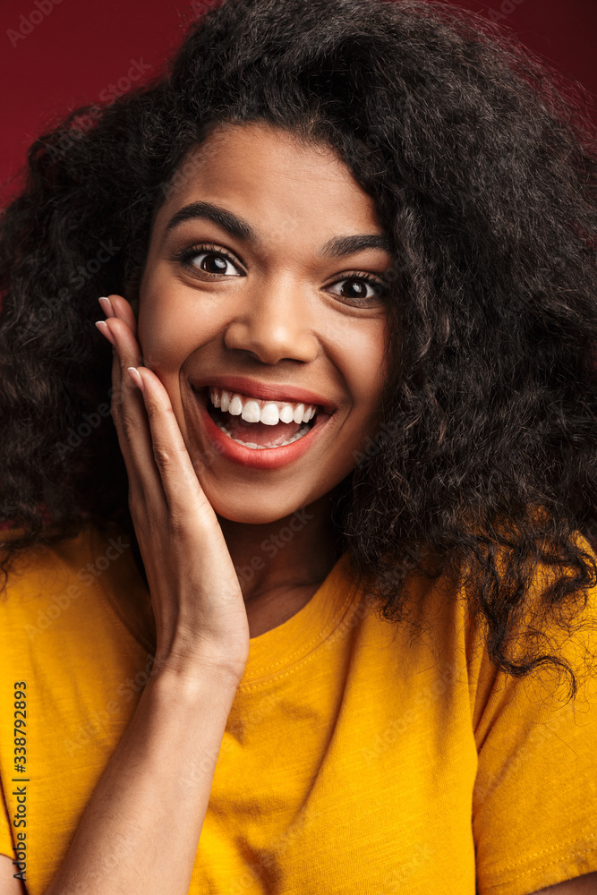 Image of beautiful brunette african american woman with curly hair smiling Image of beautiful brunette african american woman with curly hair smiling