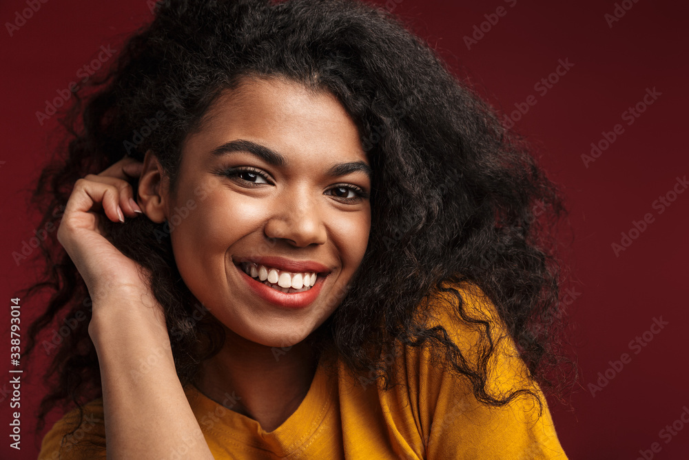 Image of beautiful brunette african american woman with curly hair smiling Image of beautiful brunette african american woman with curly hair smiling