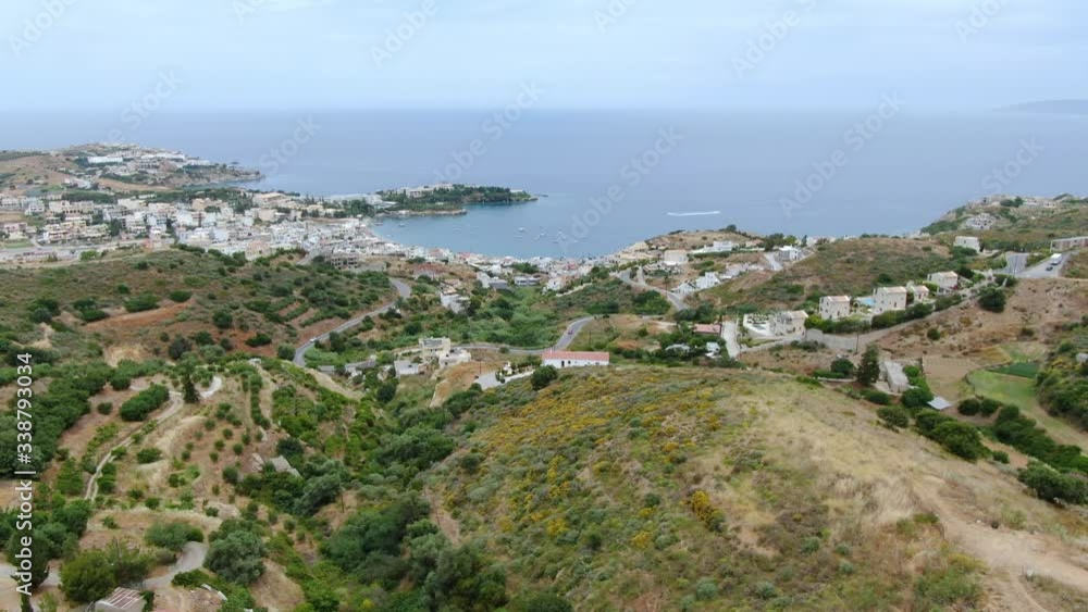 Wide aerial view of Crete Island. Farmland, costal road and paradisiac sea Wide aerial view of Crete Island. Farmland, costal road and paradisiac sea