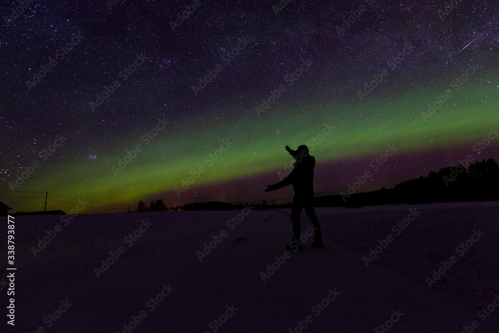 A northern light across the night in a finnish landscape. Somebody shows us the way.