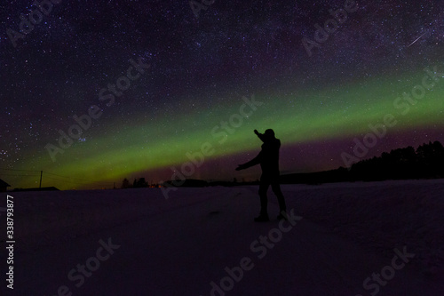 A northern light across the night in a finnish landscape. Somebody shows us the way.