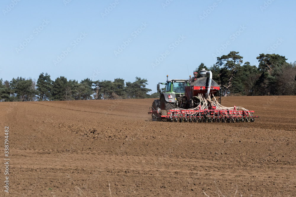 Fototapeta premium In the midst of the global corona pandemic, farmers worldwide are still working hard growing next years crop and ensuring the food supply lines can continue
