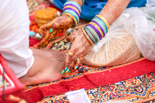 Indian Traditional Wedding: groom leg haldi ceremony