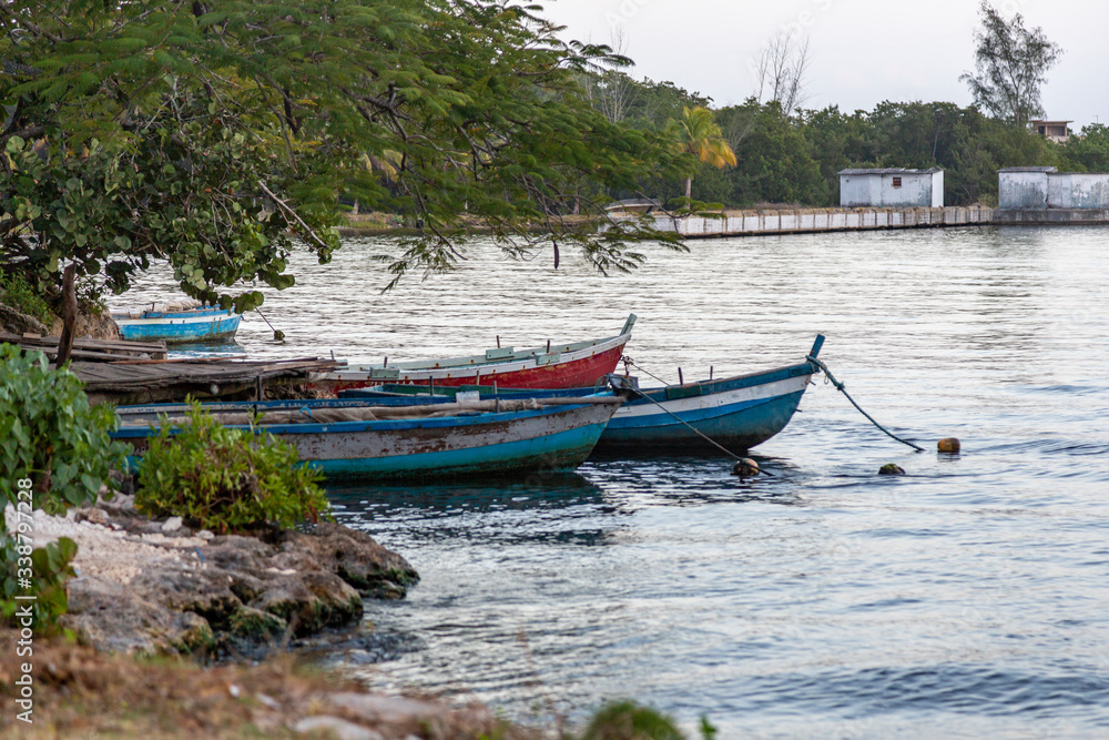 Some boats are floating in the pier of Playa Larga, a little town in the south of Cuba