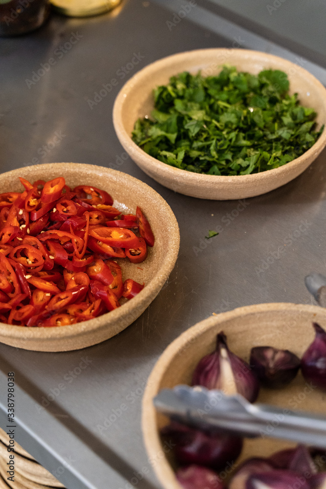 Food preparation with chillis, coriander and red onion Food preparation with chillis, coriander and red onion