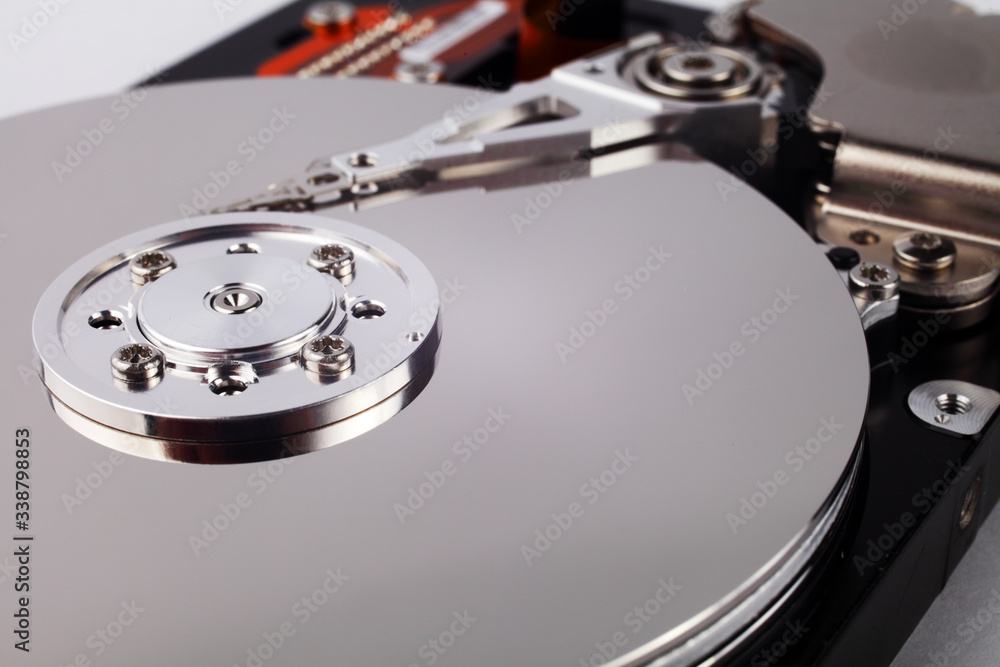 Disassembled computer hard drive with mirror disks Disassembled computer hard drive with mirror disks