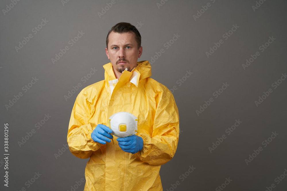 Doctor in protective suit, medical mask, and latex gloves Doctor in protective suit, medical mask, and latex gloves