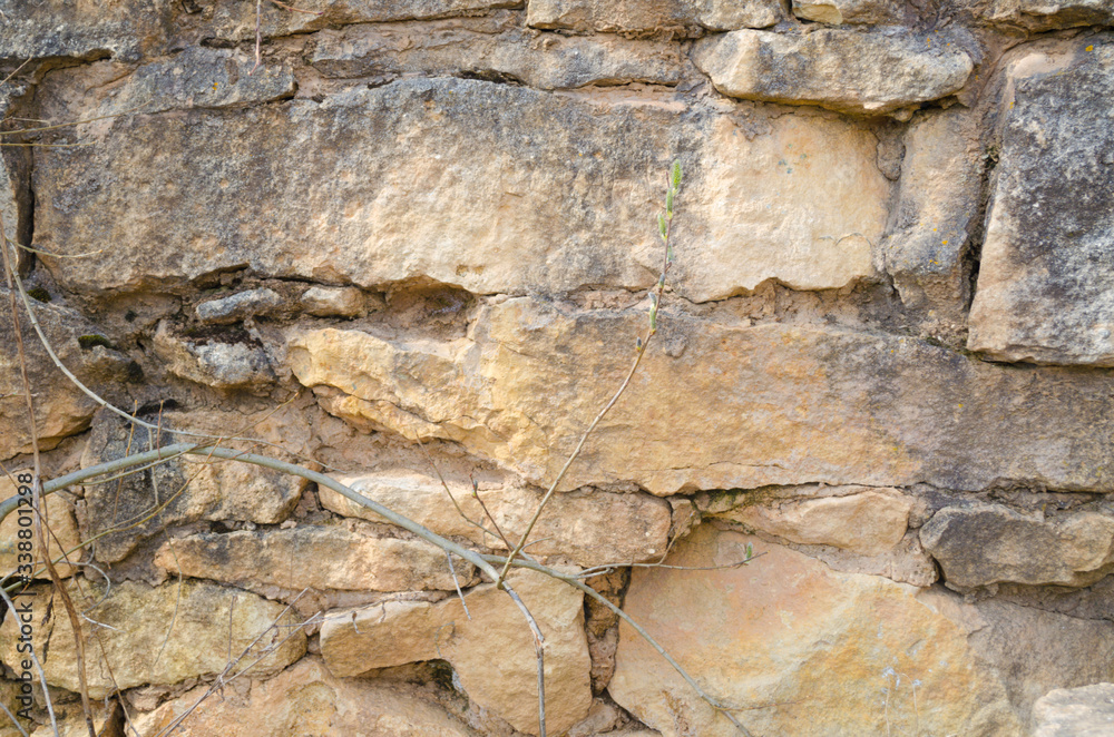 Texture and background of a stone wall, old masonry Texture and background of a stone wall, old masonry