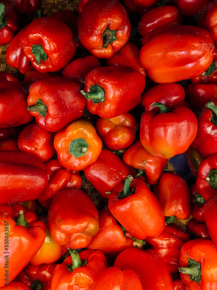 lots of ripe red Bulgarian pepper for eating background lots of ripe red Bulgarian pepper for eating background