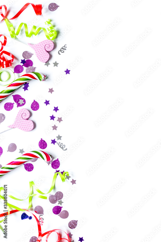 Colored party sweets and confetti on white background top view mockup Colored party sweets and confetti on white background top view mockup