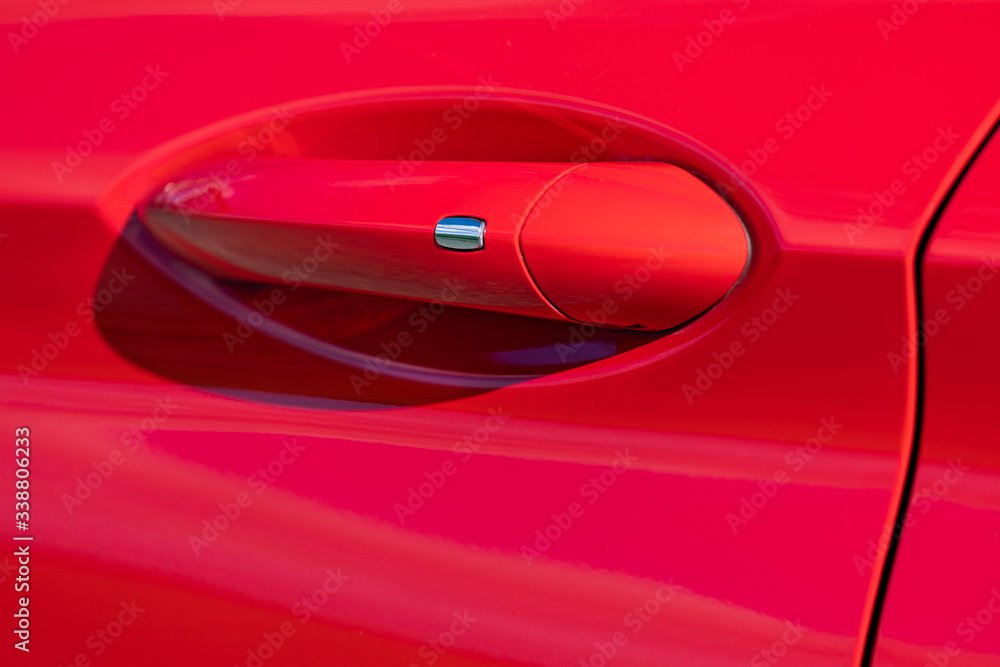 Door handle of modern red car Door handle of modern red car