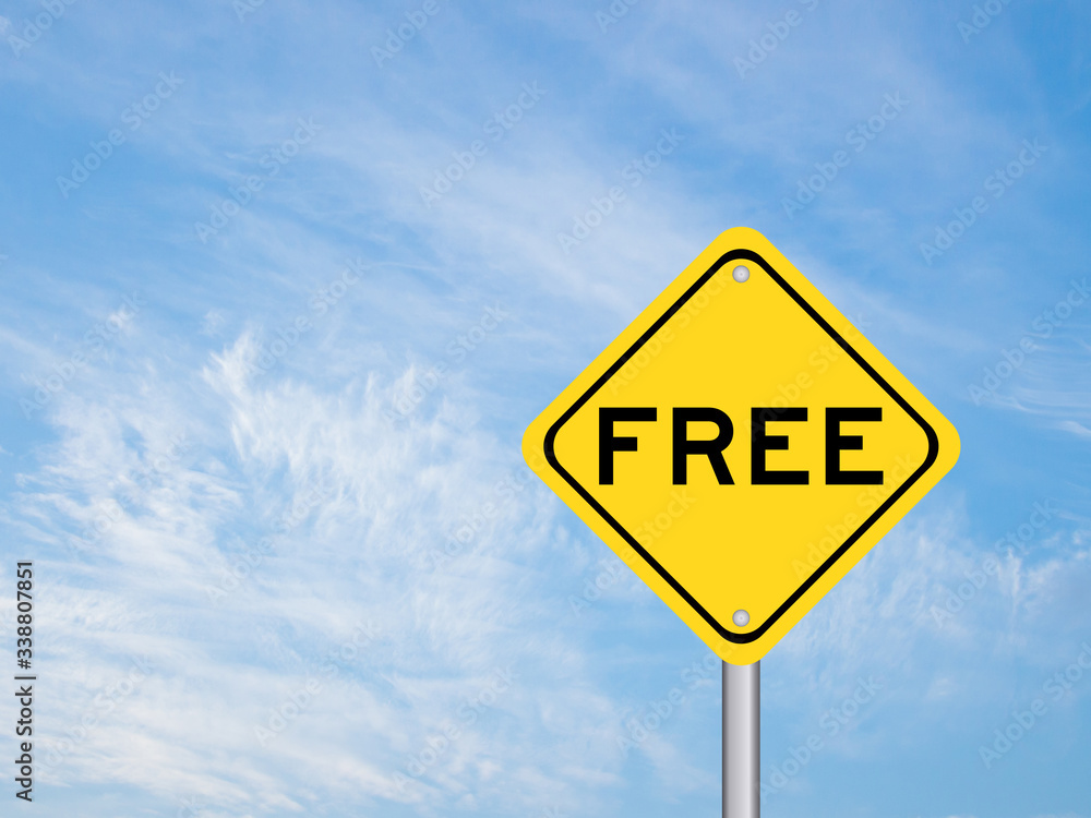 Yellow transportation sign with word free on blue sky background Yellow transportation sign with word free on blue sky background
