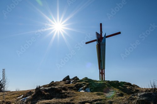 summit cross on "Mugel" mountain near "Leoben" city in styria, Austria on a sunny day
