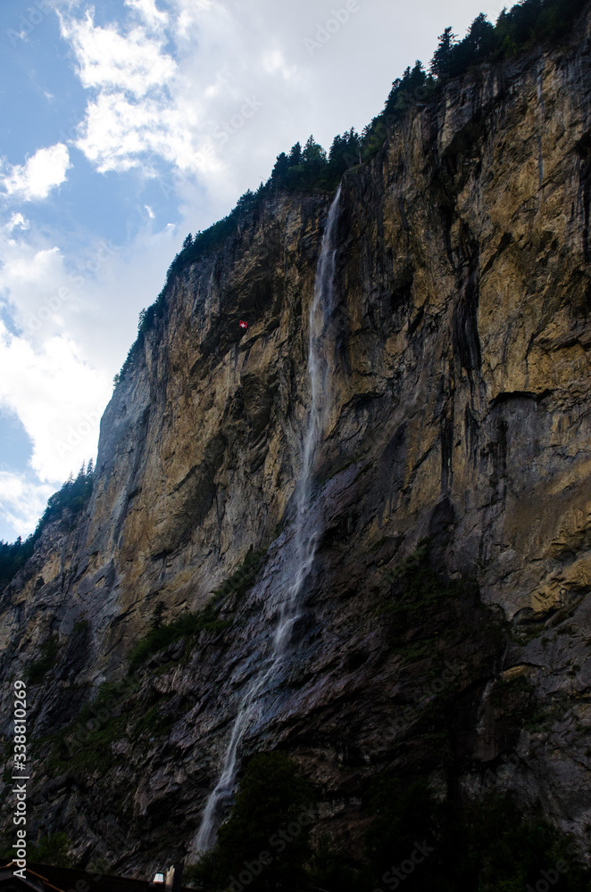 Valley of 72 waterfalls.
Waterfall on the mountain.
Alpine waterfall on a beautiful rock in the mountains.
Summer in the Lauterbrunnen valley or valley of the 72 waterfalls. Interlaken, Switzerland