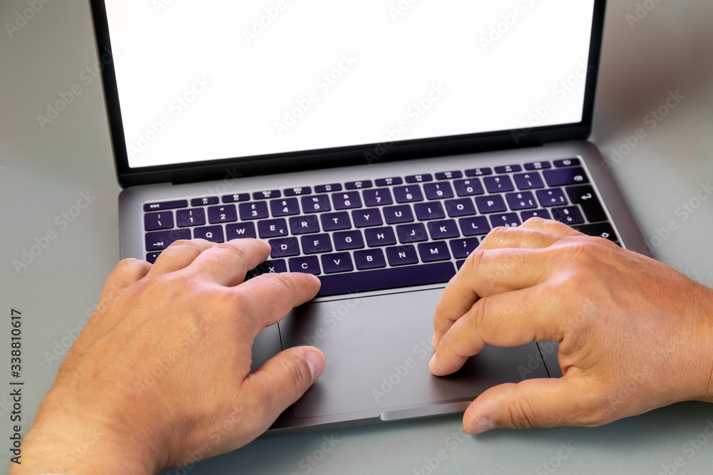 Typing on a laptop keyboard, white screen - copy space Typing on a laptop keyboard, white screen - copy space