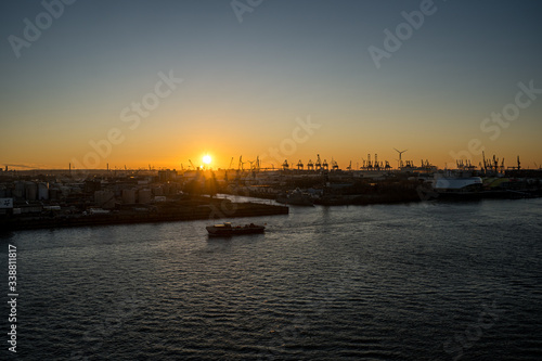 Panoramic view of the Port of Hamburg in the Hafen City at Elbe river at sunset/twilight