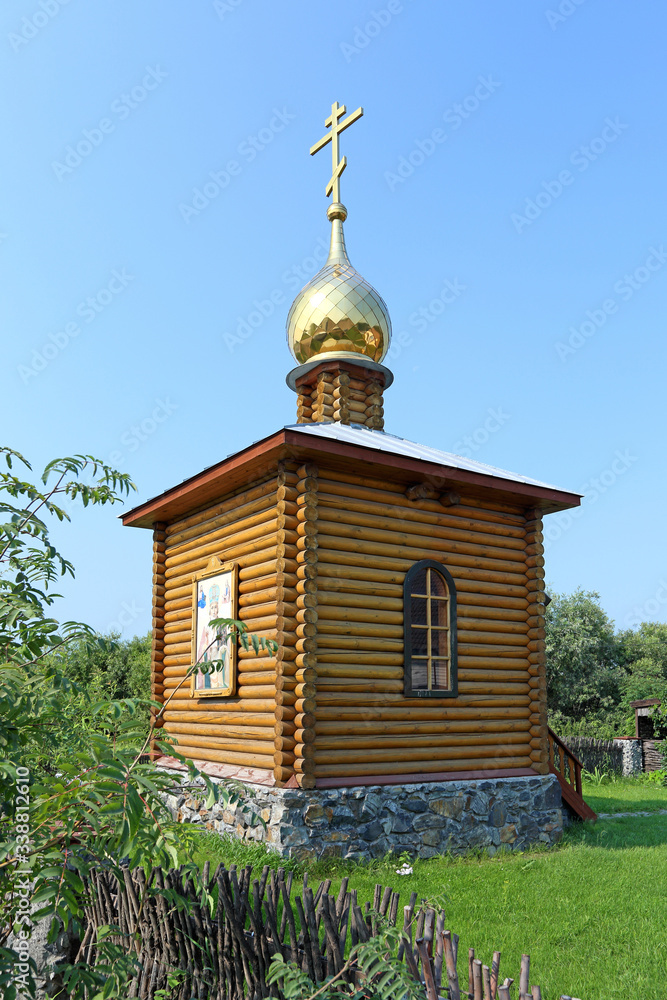 Orthodox wooden chapel on the territory of the Novosibirsk region in Siberia