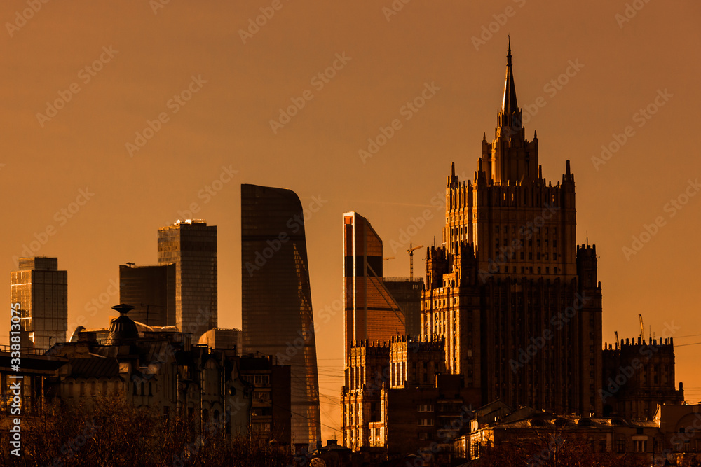 Sunny evening in Moscow. View of the building of the Ministry of Foreign Affairs and Moscow City. Bright sunset.