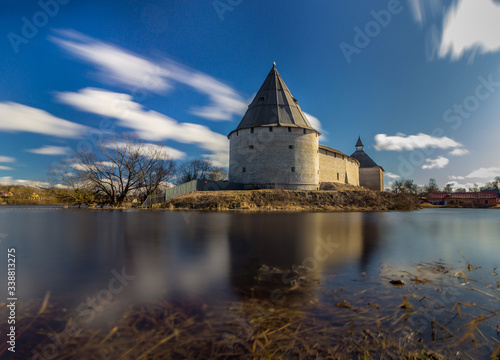 Staroladozhskaya fortress in the village of Staraya Ladoga on the banks of the Volkhov River. Historic places of Russia. Great walls, roofs for protection. Panorama photo