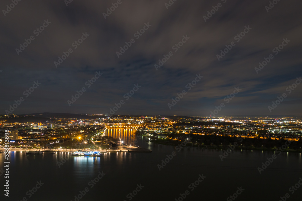 Panorama view of Koblenz, Germany at night. River Mosel runs into river Rhine at so called 