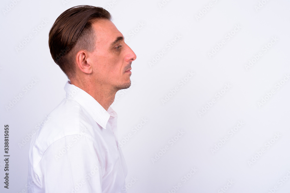 Mature handsome Italian businessman against white background Mature handsome Italian businessman against white background