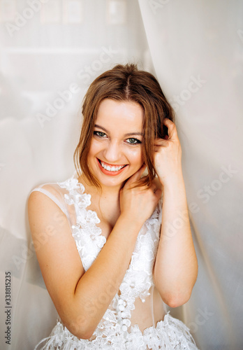 Happy bride on tulle background