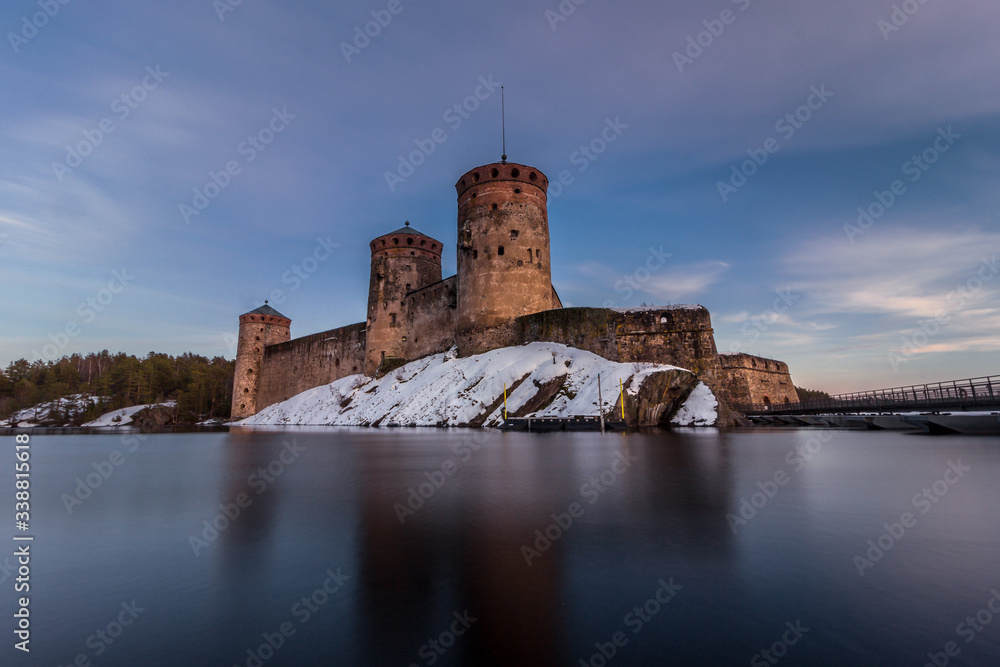 Fortress of St. Olav in the resort town of Savonlinna, southern Finland. Panorama of the castle and the bridge over the river. International events Opera festivals