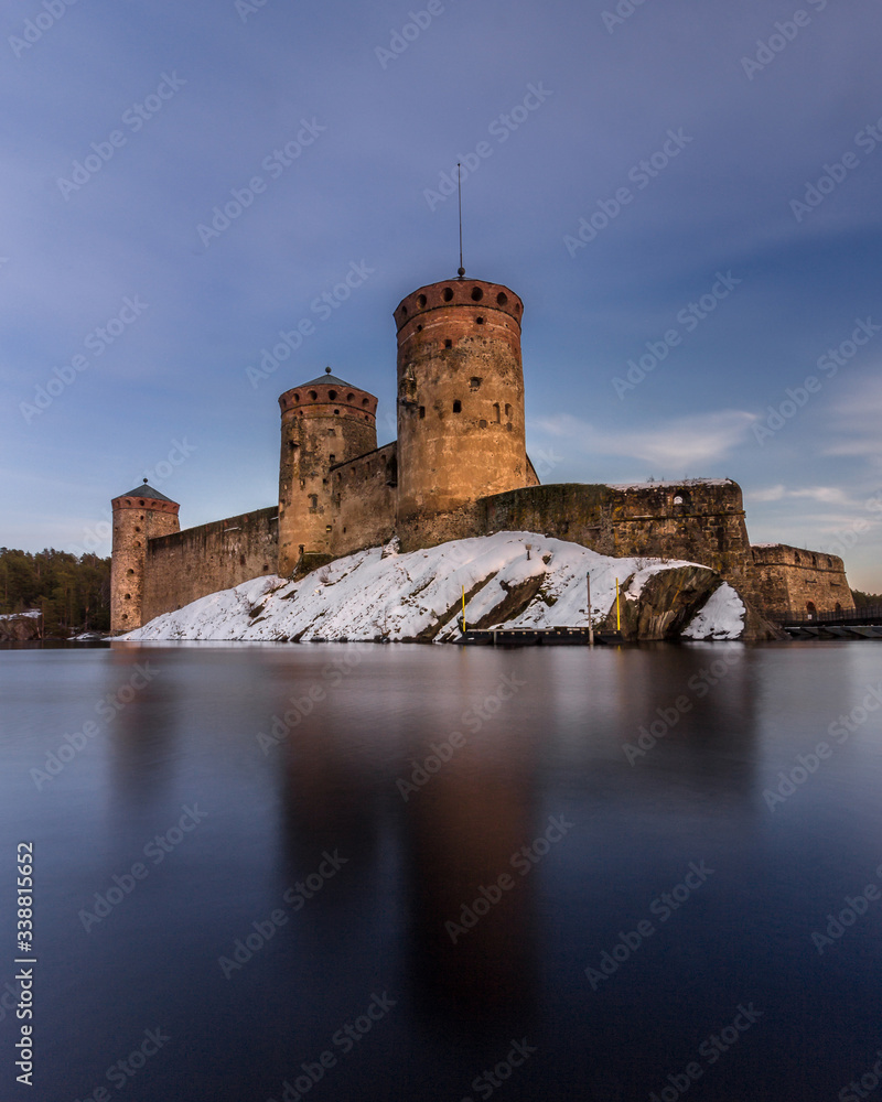 Fortress of St. Olav in the resort town of Savonlinna, southern Finland. Panorama of the castle and the bridge over the river. International events Opera festivals