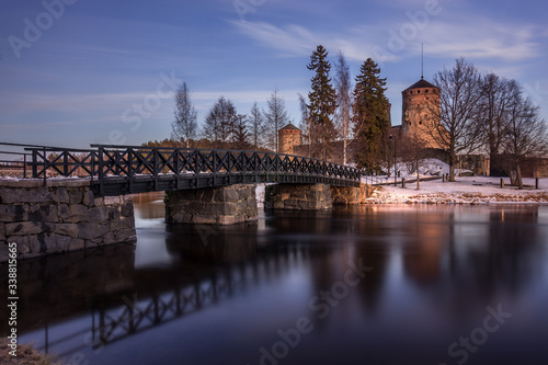 Fortress of St. Olav in the resort town of Savonlinna, southern Finland. Panorama of the castle and the bridge over the river. International events Opera festivals