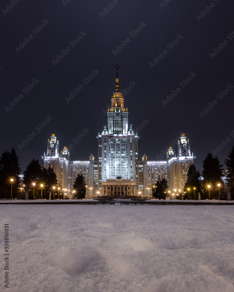 Russia, Moscow, Vorobyovy Gory, skyscraper of Moscow State University. Winter landscape, night illumination of the Stalinist skyscraper. Evening walk in the city lights