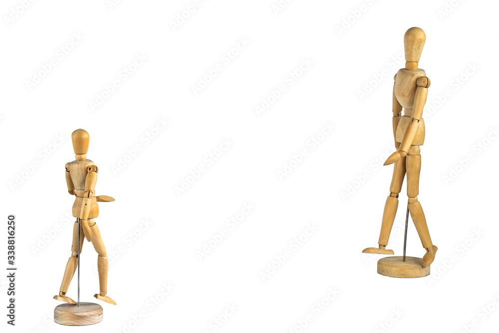 Two wooden mannequins facing each other isolated on white background - social distancing concept Two wooden mannequins facing each other isolated on white background - social distancing concept