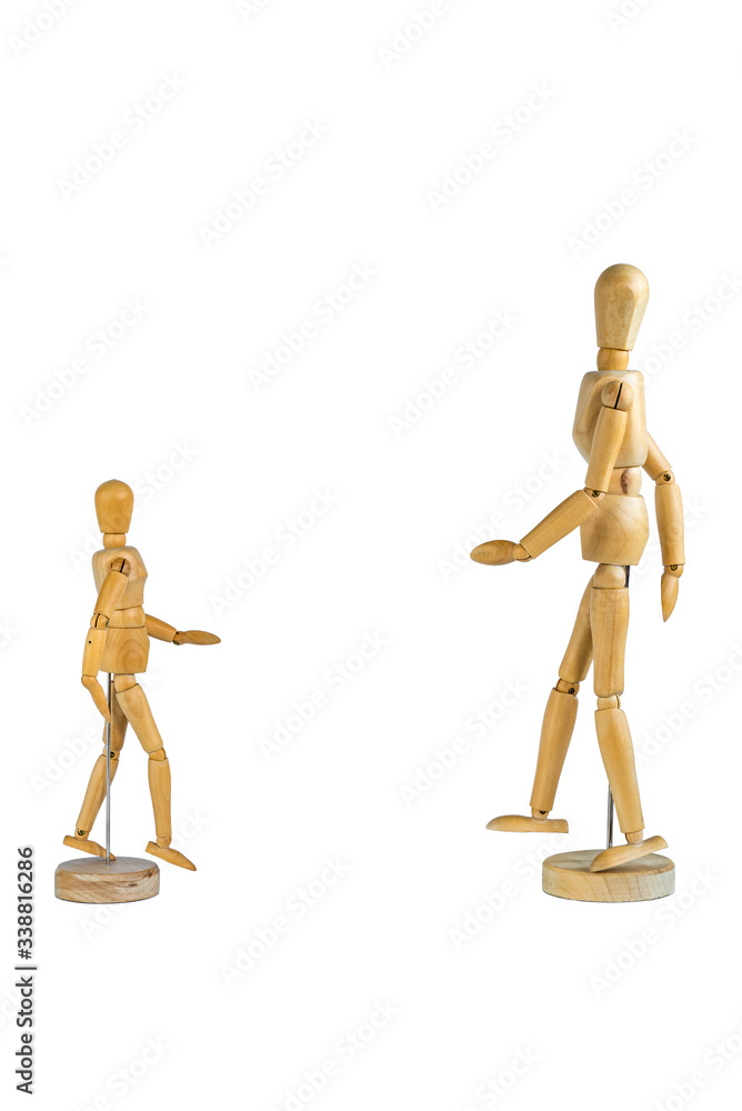 Two wooden mannequins facing each other isolated on white background - social distancing concept Two wooden mannequins facing each other isolated on white background - social distancing concept
